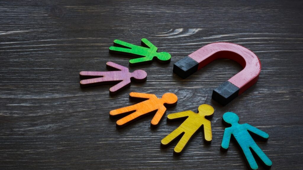 A diverse group of individuals engaging in a discussion about fundraising strategies.